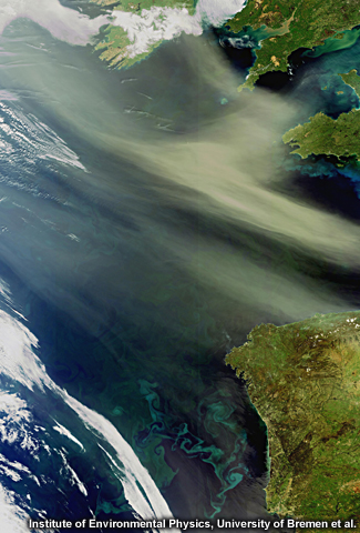Envisat captures dust and sand from the Algerian Sahara Desert, located in northern Africa, blowing west across the Atlantic Ocean. Plankton blooms are visible as blue and green swirls. 