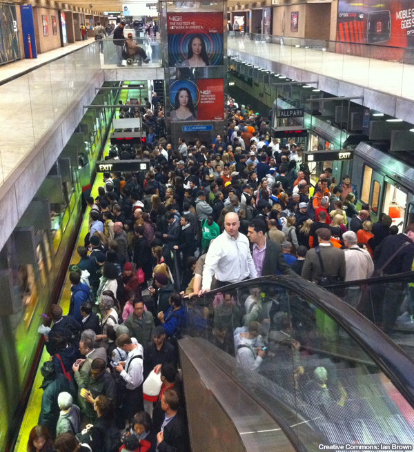 Sea Level Change, photo of crowd on the Embarcadero station MUNI platform.