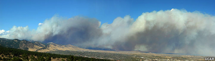 Photo of smoke plume driven by strong winds downslope and toward he east.