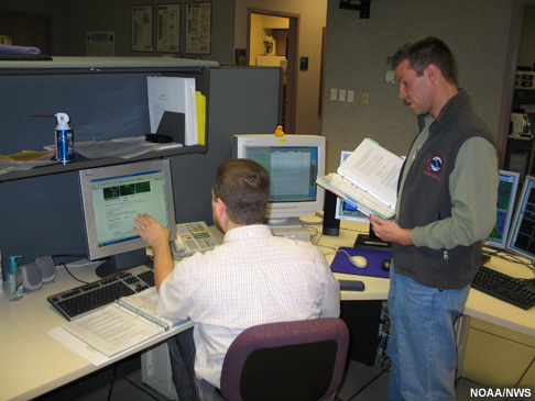 Forecasters in office examining latest fire weather data