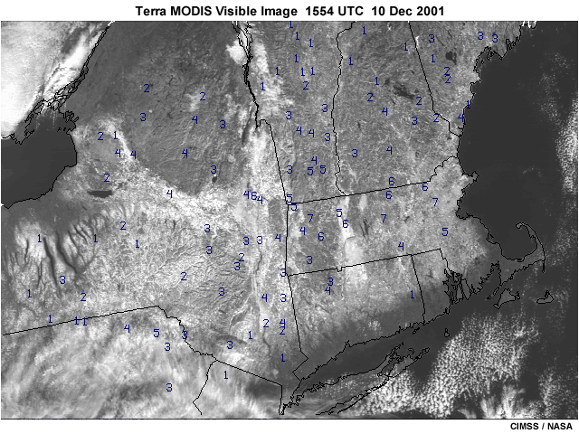 A MODIS visible image showing a variety of snow covered surfaces, fog, and bare ground, and open water surfaces.