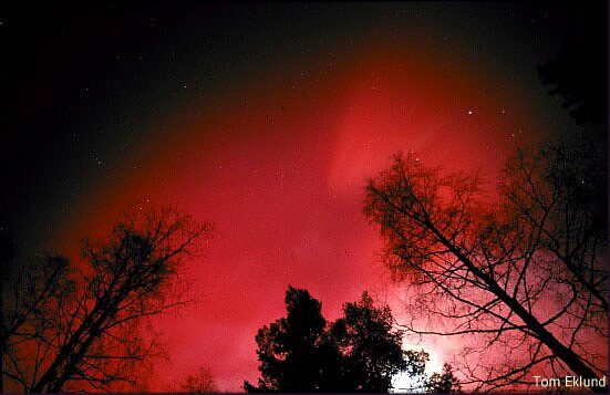 Photo of red aurora by Tom Eklund.