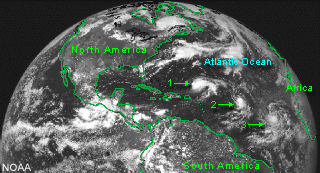 Satellite image showing three tropical cyclones in the North Atlantic Ocean.