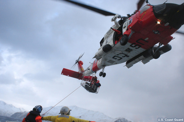 Photo of USCG Helicopter performing a rescue