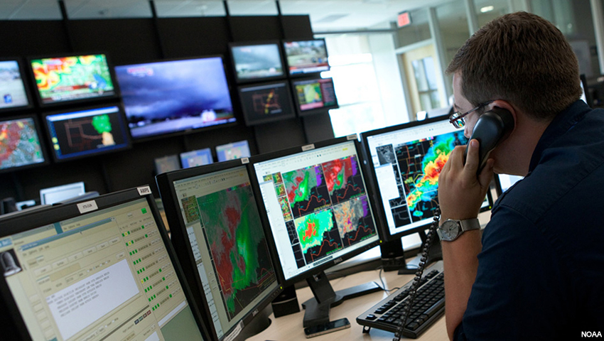 A meteorologist monitors a severe weather outbreak.