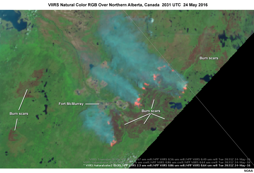 VIIRS Natural Color RGB image over northern Alberta, Canada in the region of the McMurray wildfires on 24 May 2016, showing fires in pink, smoke in dark cyan, and dark reddish areas that are burn scars marking past fires