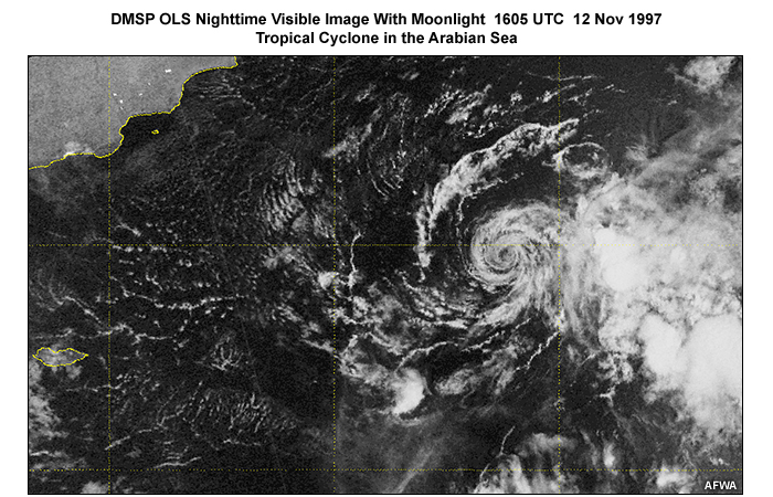 DMSP OLS nighttime visible image over the Arabian sea showing the low level circulation of a tropical cyclone illuminated by moonlight conditions; taken at 1605 UTC (local evening) on November 12, 1997.