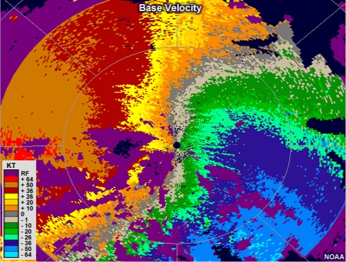 base velocity animation showing several small couplets within a background of very strong southeasterly winds.
