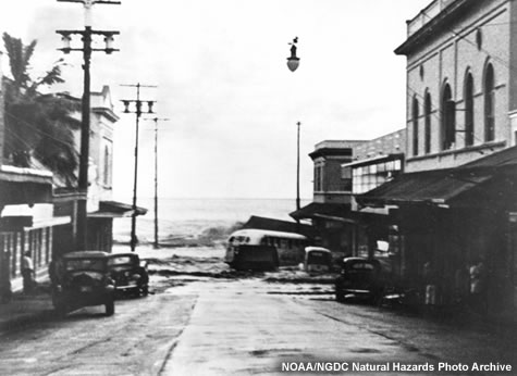 The second wave of the 1946 Alaska tsunami strikes Hilo, Hawaii.