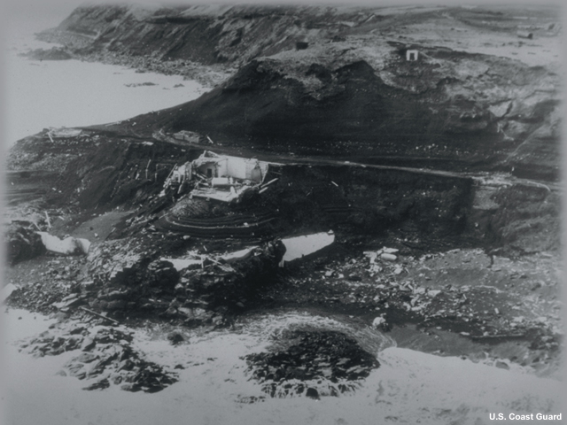 The Scotch Cap Lighthouse on Unimak Island, Alaska after the earthquake and tsunami. A magnitude 8.0 (Mw) earthquake with the source to the south of Unimak Island generated a tsunami that destroyed the five-story lighthouse, located 9.8 m above sea level. Only the foundation and part of the concrete sea wall remained. All five occupants were killed. The waves deposited debris as high as 35 m above the sea. Although little damage occurred in Alaska, except at Scotch Cap, the tsunami was one of the most destructive ever to occur in the Hawaiian Islands.