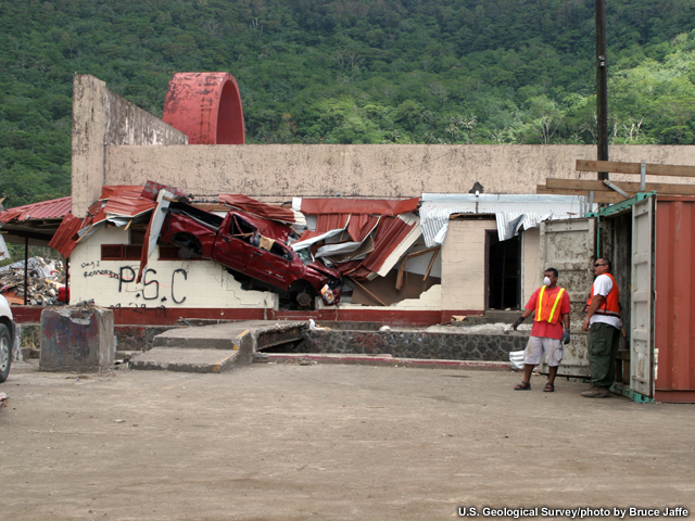 Truck thrown into a building in Pago Pago, Samoa following the tsunami of 2009
