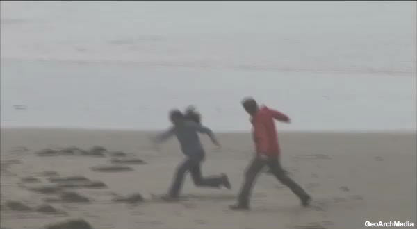 video of earthquake felt on beach and people quickly evacuating toward high ground