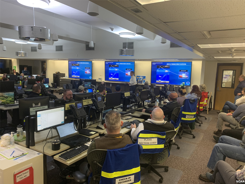 Tsunami Warning Center personnel presenting to partners in the Emergency Operations Center.