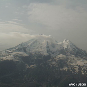 Short smoke plume drifts away from the crater of Mt. Redoubt on this webcam image.